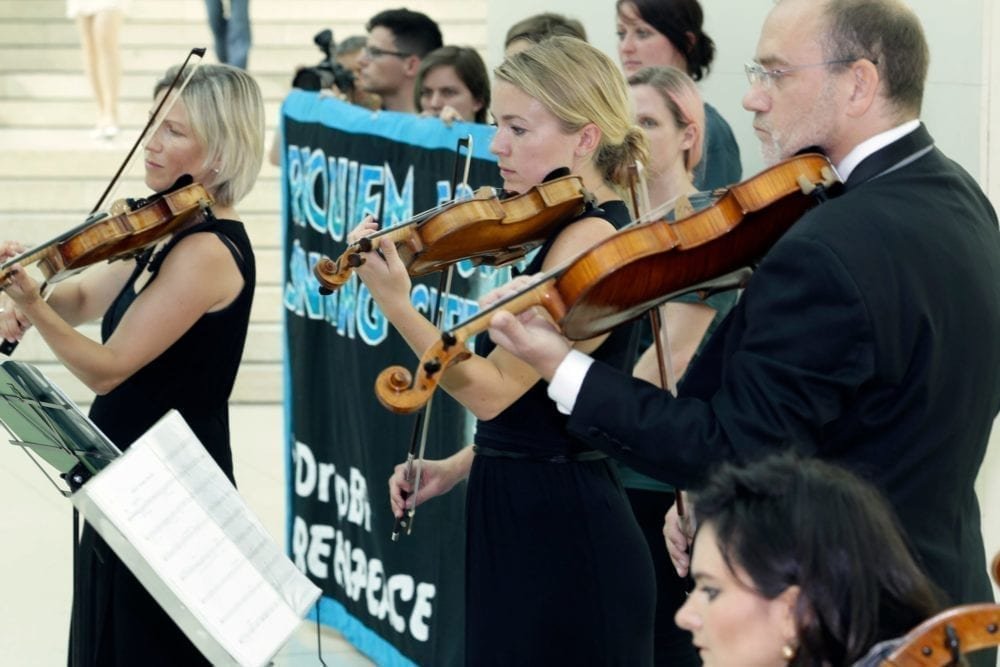 A string quartet, in the British Museum’s iconic covered courtyard, plays ‘Requiem for Sinking Cities’. The performance included the delivery of over 25,000 messages from people opposed to the British Museum’s decision to renew BP’s sponsorship for five more years.