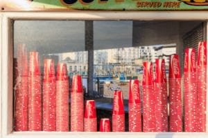 Coca-Cola cups at a kiosk on the Brighton pier