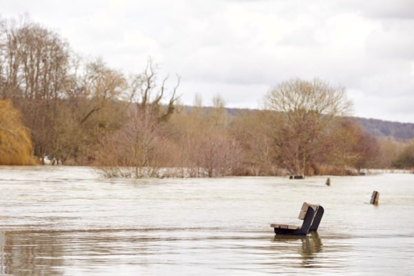 Benches Submerged As River Thames Floods And Bursts In Banks In UK