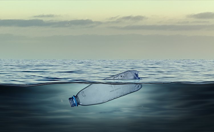 A plastic bottle bobbing on the surface of the ocean
