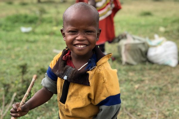 A young Maasai smiling at the camera in Tanzania