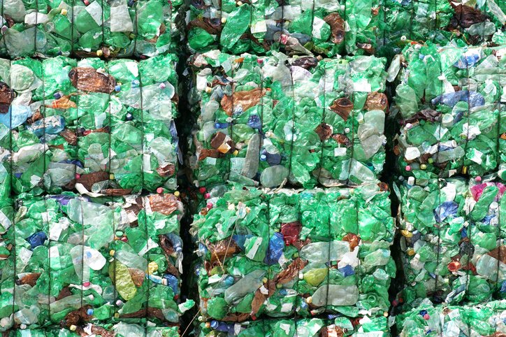 Green plastic bottles ready for recycling