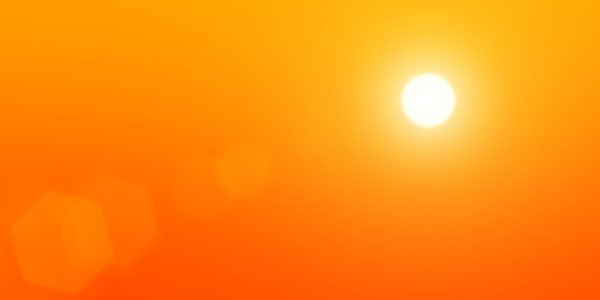 The sun on a background of orange sky
