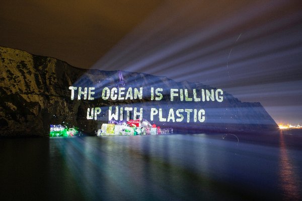 A 100mx400m projection of packaging waste stacked up against the iconic White Cliffs of Dover
