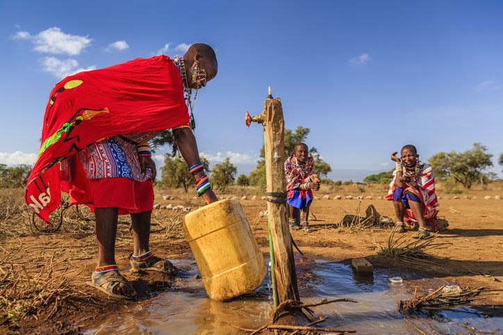 African woman from Maasai tribe collecting water, Kenya, East Africa