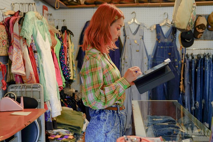 Young woman managing a secondhand store