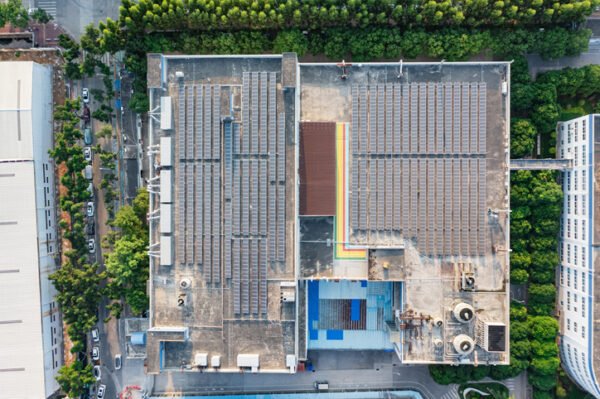 Aerial view of solar photovoltaic power station on factory roof