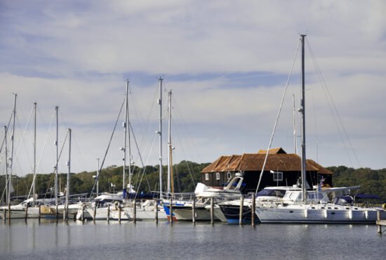 Chichester harbour, a large port, harbour and marina for boats situated several miles inland from the sea in a safe haven