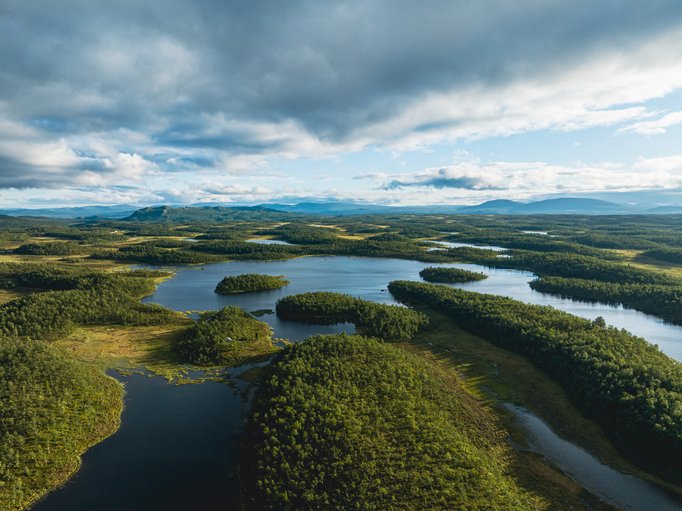 Green forest and blue lakes landscape in the region of Jamtland Harjedalen, Sweden