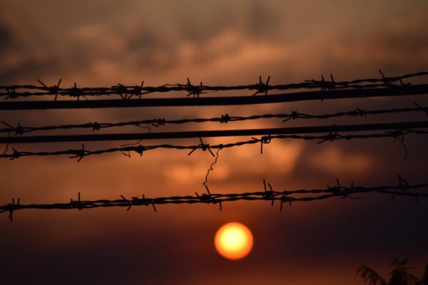 Sunset behind barbed wire in Sudan