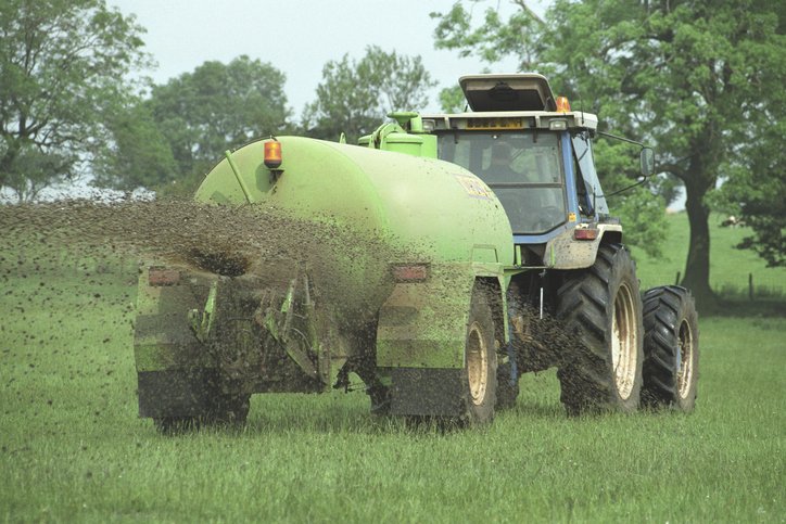 Agricultural slurry spreading in a field in England, United Kingdom