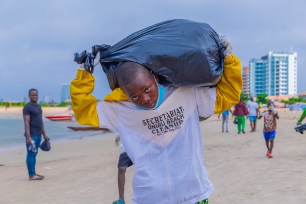 Young volunteer at a beach cleanup in Lagos (2022)