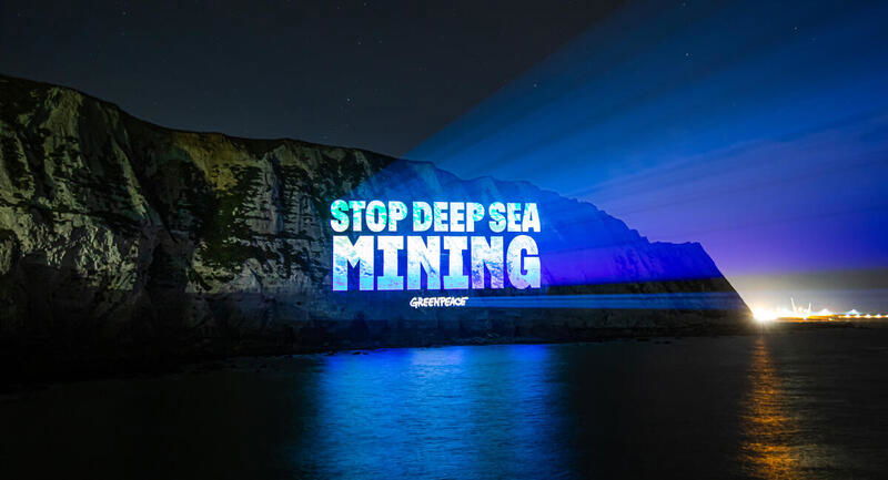 Greenpeace projects 'Stop Deep Sea Mining' on the White Cliffs of Dover, calling for a halt to deep-sea mining