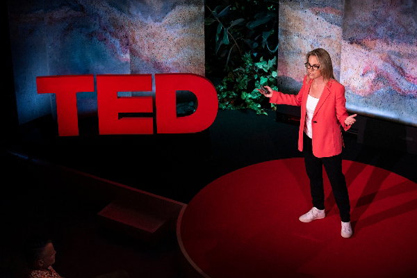 Tessa Clarke, co-founder and CEO at Olio, at her TED talk, 'The Surprising Climate Benefits of Sharing Your Stuff'. Credit Gilberto Tadday and TED